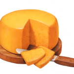 Cheddar cheese wheel on a wooden cutting board with a cheese knife and two cut cheese slices