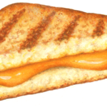 Cut grilled cheese sandwich with melted cheddar cheese.